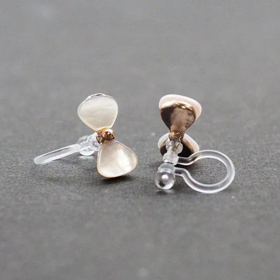 Mother Of Pearl Bow Tie Invisible Clip On Stud Earrings (Gold tone)